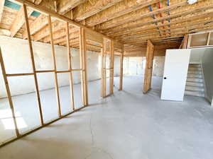Unfinished basement with stairs