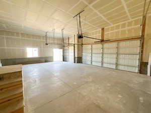 Garage featuring a garage door opener