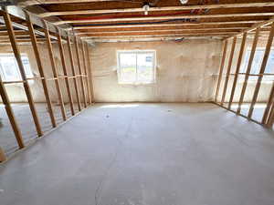 Misc room with unfinished concrete floors