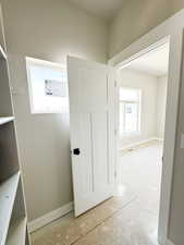 Hallway featuring baseboards