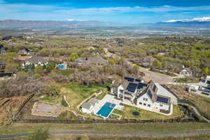 Birds eye view of property with a mountain view