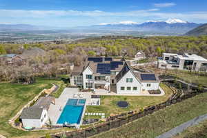 Birds eye view of property with a mountain view