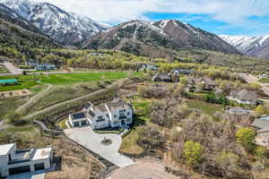 Birds eye view of property with a residential view and a mountain view