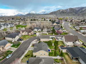 Birds eye view of property with a mountain view and a residential view