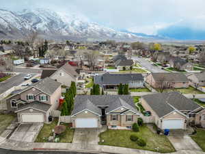 Birds eye view of property with a mountain view and a residential view