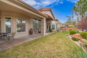 View of yard featuring a patio area and fence