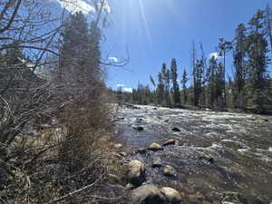 View of landscape featuring a forest view
