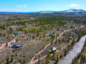 Birds eye view of property with a mountain view and a rural view