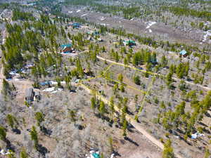 Birds eye view of property featuring a rural view