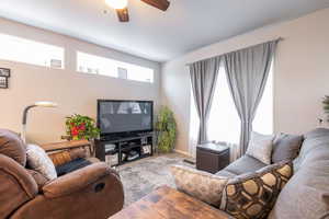 Living area featuring wood finished floors and ceiling fan