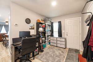Office space featuring a ceiling fan and light wood-style floors