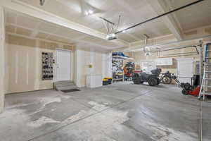 Garage featuring a garage door opener
