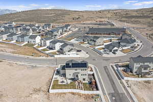 Drone / aerial view featuring a mountain view and a residential view