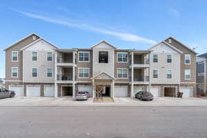 View of building exterior featuring an attached garage