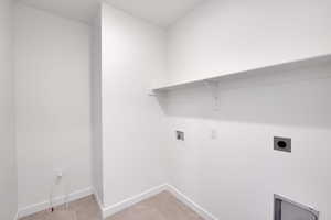 Washroom featuring electric dryer hookup, laundry area, baseboards, and washer hookup