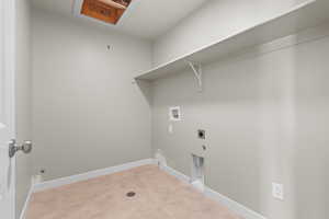 Washroom featuring laundry area, hookup for an electric dryer, baseboards, and hookup for a washing machine