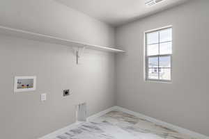 Laundry room with electric dryer hookup, baseboards, visible vents, laundry area, and hookup for a washing machine