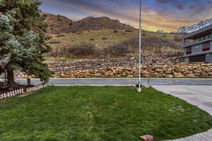 Yard at dusk with a mountain view