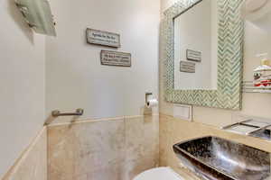 Bathroom featuring a sink and toilet