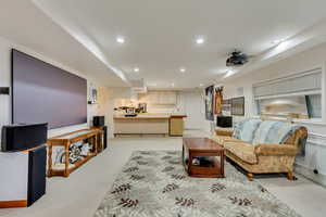 Living area with baseboards and recessed lighting