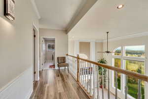 Corridor featuring recessed lighting, light wood-style floors, and crown molding