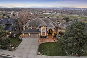 Aerial view at dusk featuring a residential view