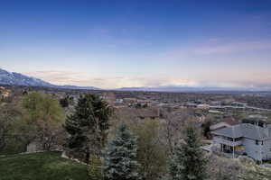 Aerial view at dusk featuring a mountain view