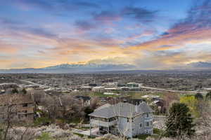 Aerial view at dusk featuring a mountain view