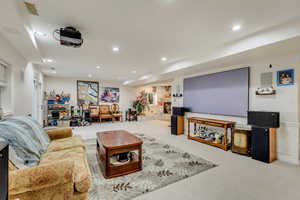 Living area featuring recessed lighting and wainscoting