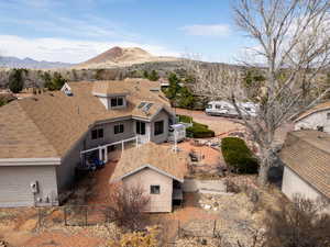 Birds eye view of property with a mountain view