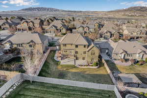 Drone / aerial view featuring a mountain view and a residential view