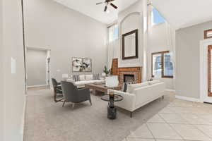 Virtually staged living room with valued ceilings and large windows for tons of light