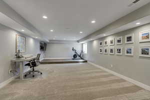 Workout room featuring carpet flooring, baseboards, visible vents, and recessed lighting
