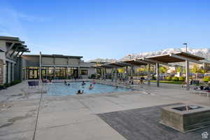 View of swimming pool with a mountain view and a patio area