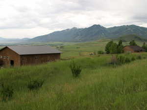View of mountain background featuring rural landscape