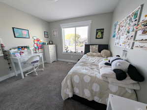 Bedroom with carpet and baseboards