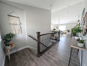 Stairway/Entry featuring  wood LVP floors.