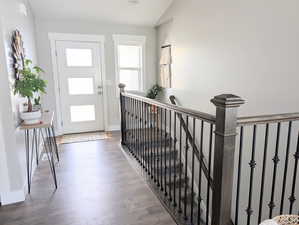 Entrance foyer featuring Wood/Steel railing and LVP flooring.