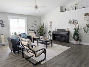 Living area with ceiling fan, baseboards, and LVP floors