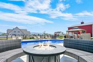 View of 20x40 vinyl sports liner salt water pool, a gazebo, a patio, and a fenced backyard