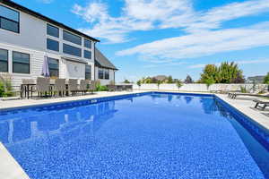 View of 20x40 vinyl sports liner salt water pool, a gazebo, a patio, and a fenced backyard