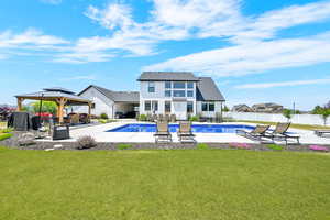 View of 20x40 vinyl sports liner salt water pool, a gazebo, a patio, and a fenced backyard