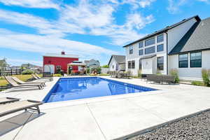 View of 20x40 vinyl sports liner salt water pool, a gazebo, a patio, and a fenced backyard