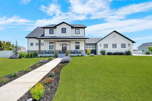Modern Farmhouse with barndoor Breezeway enclosure between the residence and 3 car carriage garage.