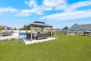 Fenced backyard with a gazebo and a patio