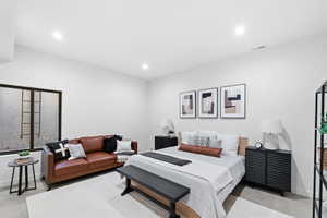 Bedroom with baseboards, visible vents, and recessed lighting