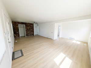 Interior space featuring visible vents and light wood-type flooring