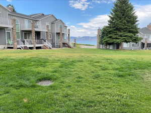 View of yard with a water view