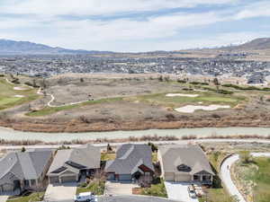 Bird's eye view featuring golf course view, a residential view, and a mountain view