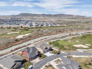 Bird's eye view featuring a mountain view, golf course view, and a residential view